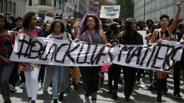 Demonstrators from the Black Lives Matter movement marching through central London in July 2016