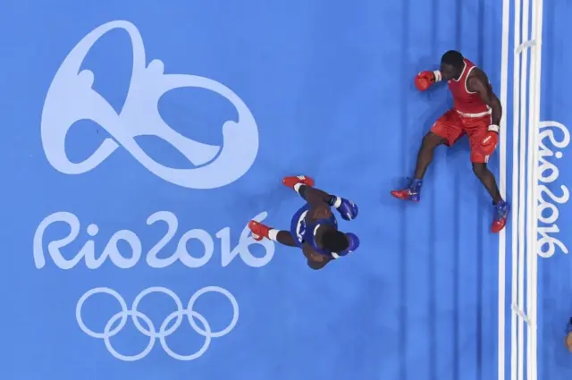 . Kennedy Katende (UGA) of Uganda falls during his bout against Joshua Buatsi