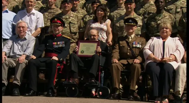 Albert Broadbent surrounded by family and service personnel