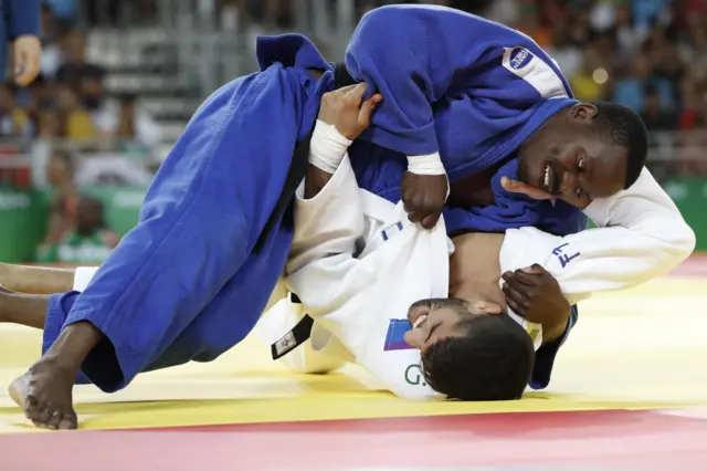 Israel"s Golan Pollack (white) competes with Zambia"s Mathews Punza in 66kg judo contest