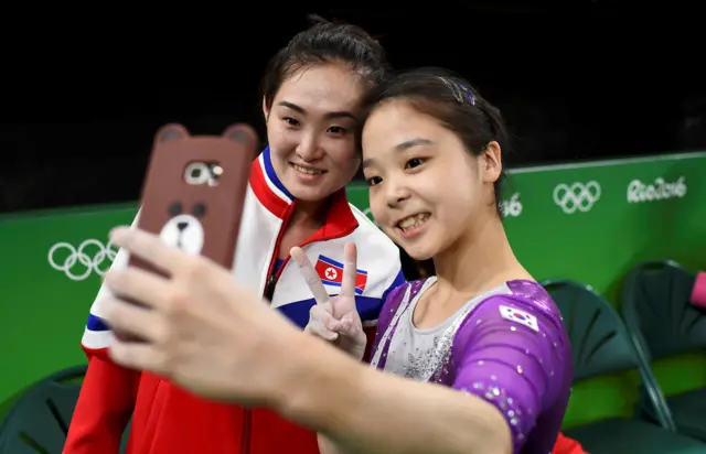 South Korea's Lee Eun-ju with Hong Un-jong of North Korea