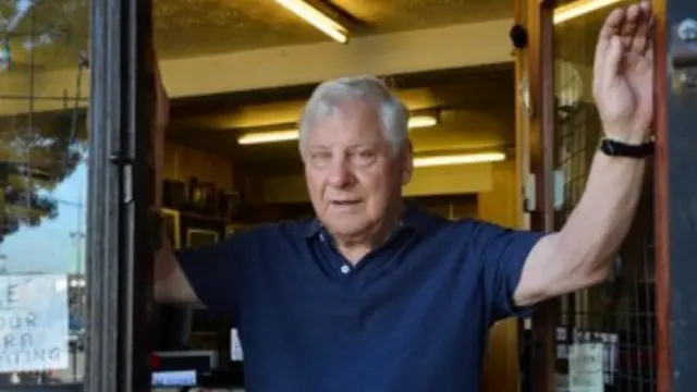 Stan Meigh in his shop doorway