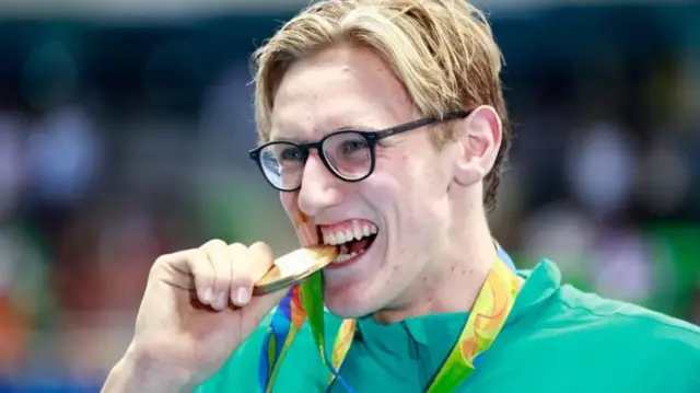 Mack Horton bites Olympic gold medal
