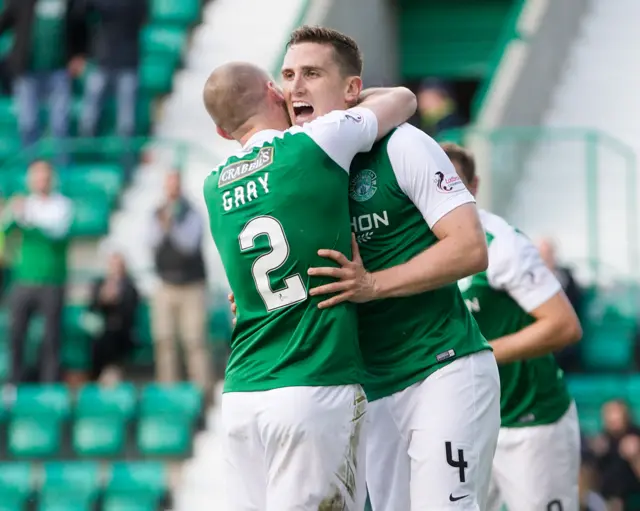 David Gray congratulates Paul Hanlon on his goal, but Hibs have since been pegged back by the Dumfries men.