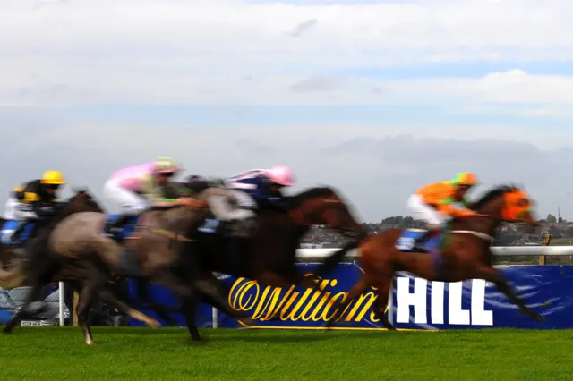 William Hill banner behind a horse race