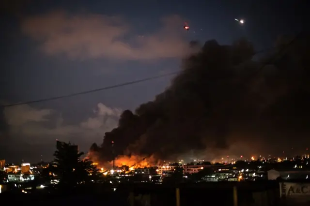 Smoke billows from the national assembly