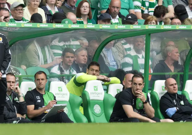 Craig Gordon takes his seat on the bench for Celtic against Aberdeen