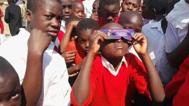 Children looking at the eclipse