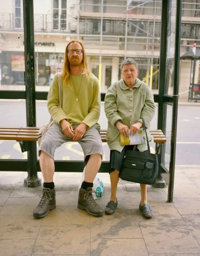 Couple at a bus stop in Leamington