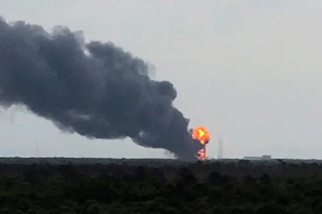 Plume of smoke above launch pad