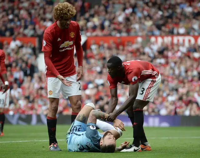 Otamendi is helped up by Bailly and Fellaini