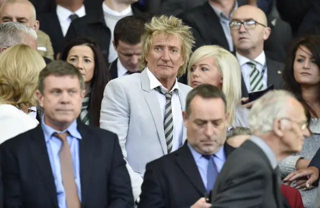 Rod Stewart takes in the match, surely straining to start the singing in the posh seats