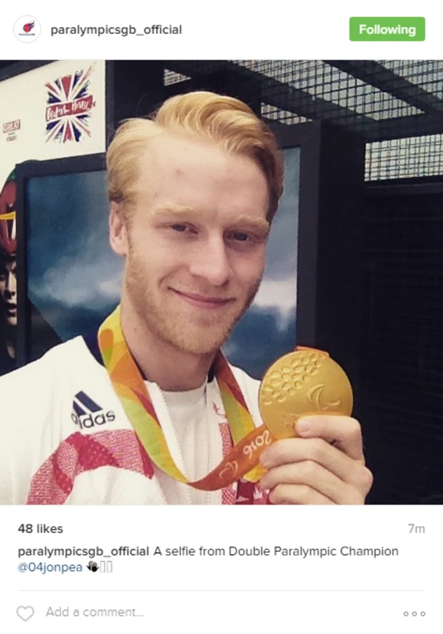 GB's Jonnie Peacock shows off his T44 100m gold medal this morning at British House in Rio