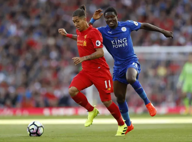 Firmino in action with Leicester City's Daniel Amartey