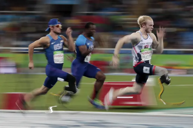 Jonnie Peacock pulls clear of the field in the T44 100m final