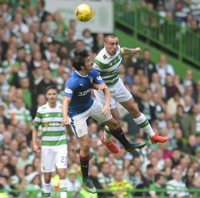 Joey Barton and Scott Brown go up for a high ball