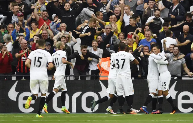 Jose Holebas celebrates