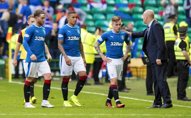 Mark Warburton consoles his players at full-time at Celtic Park