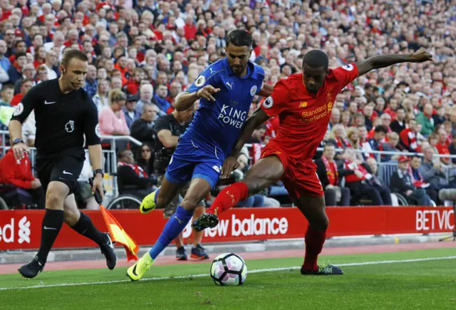 Riyad Mahrez in action with Liverpool's Georginio Wijnaldum