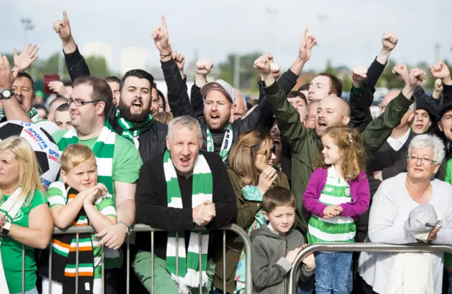 Celtic fans gather outside the stadium to welcome the their team