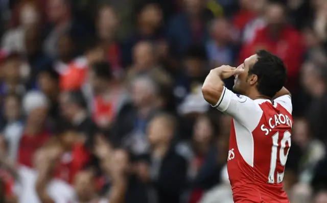 Santi Cazorla celebrates