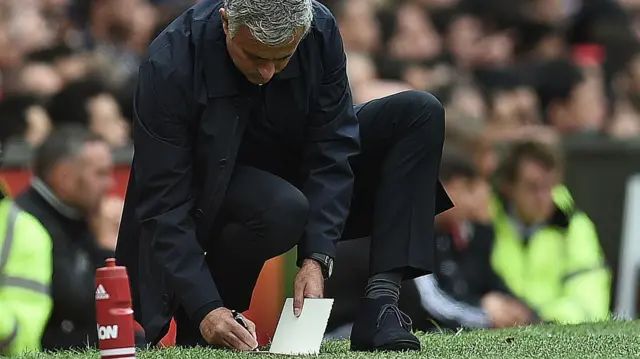 Jose Mourinho makes notes