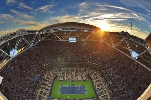 The sunsets behind the Arthur Ashe Stadium