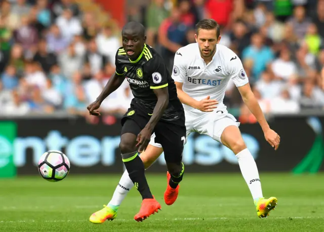 Kante battles for the ball with Sigurdsson