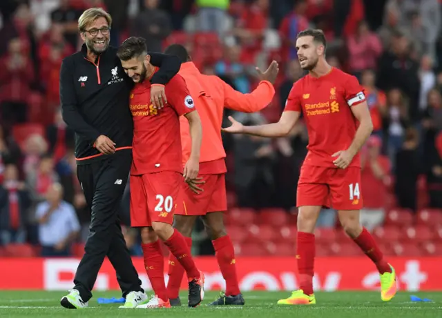 Klopp celebrates with Lallana on the pitch