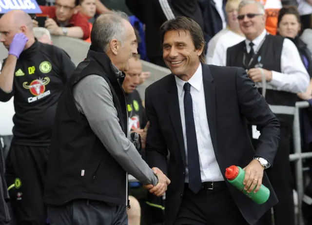 Conte and Guidolin shake hands