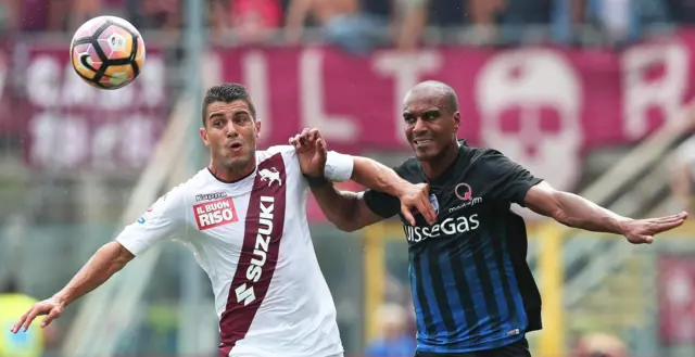 Atalanta's Abdoulaye Konko (R) in action against Torino's Iago Falque