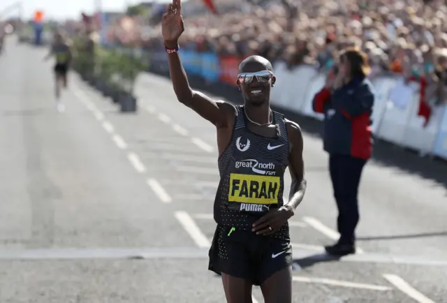 Farah celebrates winning his third Great North Run title