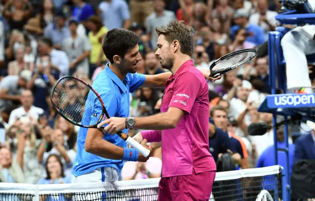 Stan Wawrinka of Switzerland embraces Novak Djokovic