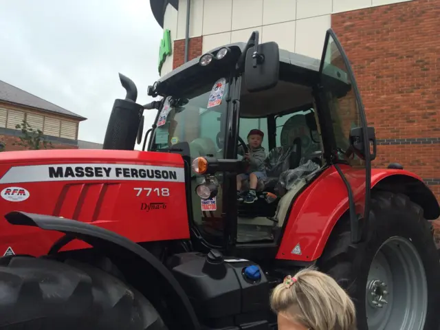 Red tractor outside supermarket in Worcester