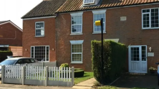 A box in the garden of a house