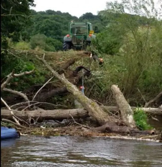 Pulling debris from River Severn