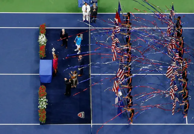 Stan Wawrinka of Switzerland celebrates with the trophy