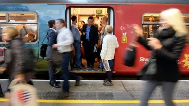 Passengers getting off a train