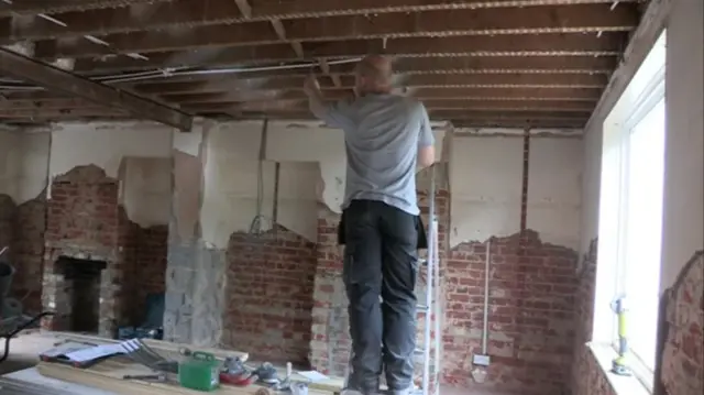 An inmate working inside a property