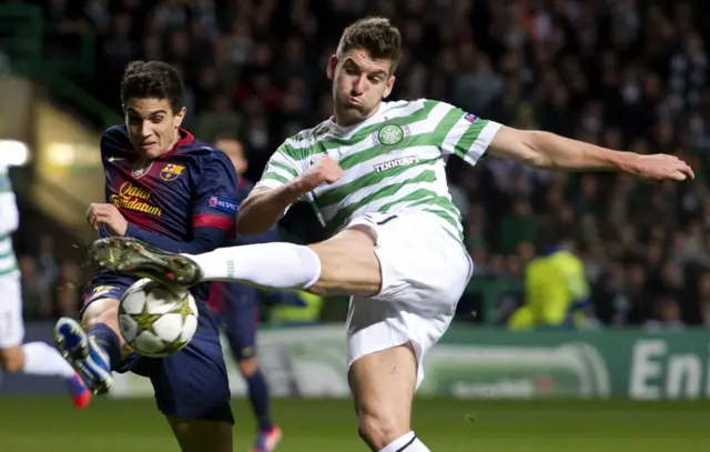 Charlie Mulgrew competes for the ball with Barca's Marc Bartra in the Scots' 2-1 win in November 2012