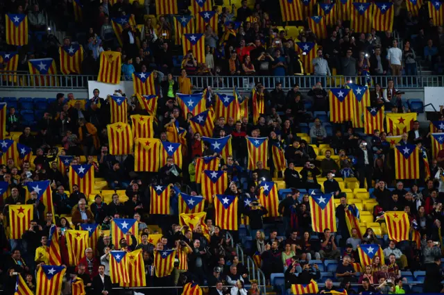 Barcelona fans display esteladas at the Nou Camp