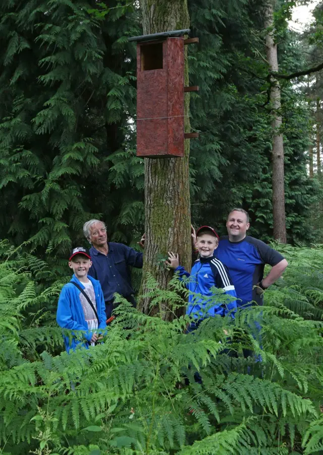 Family with owl box