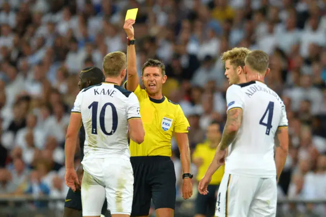 Harry Kane receives a yellow card