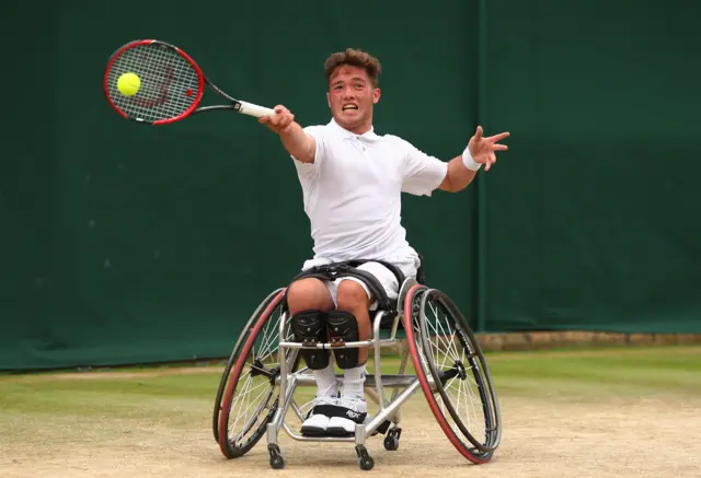 Alfie Hewett of Great Britain (partner of Gordon Reid of Great Britain) plays a forehand during the Men's Wheelchair Doubles Final against Stephane Houdet of France and Nicolas Peifer of France