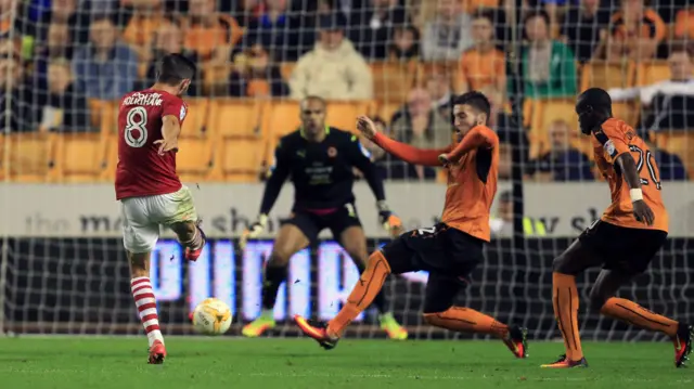 Barnsley"s Conor Hourihane (left) scores his side"s first goal of the game against Wolverhampton Wanderers