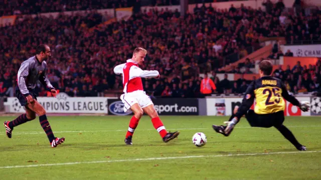 Dennis Bergkamp scoring for Arsenal against Barcelona at Wembley in October 1999
