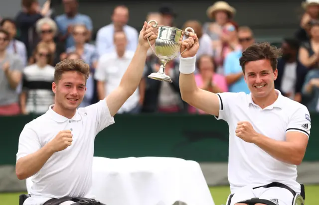 Gordon Reid of Great Britain (R) and Alfie Hewett of Great Britain (L) celebrate victory during the Men's Wheelchair Doubles Final against Stephane Houdet of France and Nicolas Peifer of France on day twelve of the Wimbledon Lawn Tennis Championships at the All England Lawn Tennis and Croquet Club