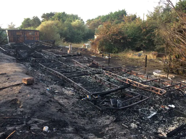 The ruins of the building destroyed in the fire