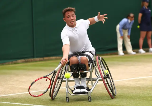 Alfie Hewett of Great Britain (partner of Gordon Reid of Great Britain) plays a forehand during the Men's Wheelchair Doubles Final against Stephane Houdet of France and Nicolas Peifer of France