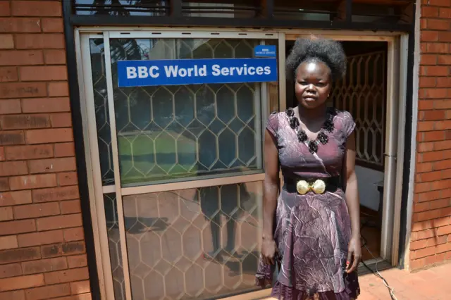 Betty standing outside the BBC office in Kampala